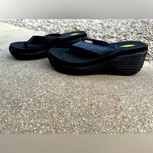 New size 7 black volatile wedge flip flops